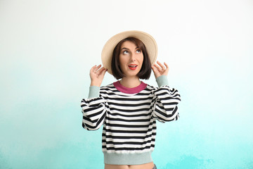 Portrait of beautiful woman on color background