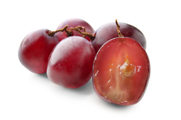 Ripe grapes on white background