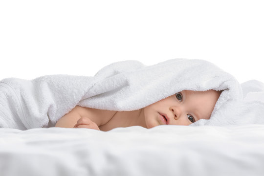 Cute little baby with soft towel on white background
