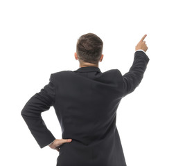 Fototapeta premium Businessman pointing at something on white background, back view
