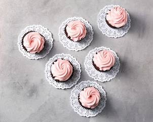 Delicious cupcakes on grey table