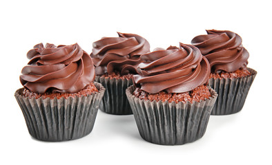Delicious chocolate cupcakes on white background