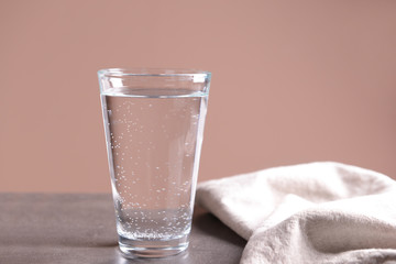Glass of cold water on table