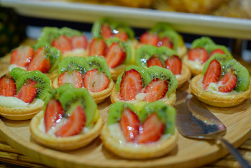 pastries with fruit and cream on a buffet