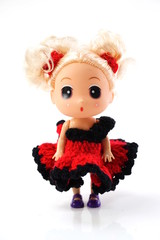 beautiful baby doll with red dress isolated on white background