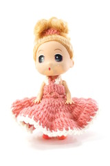 beautiful baby doll with pink dress isolated on white background