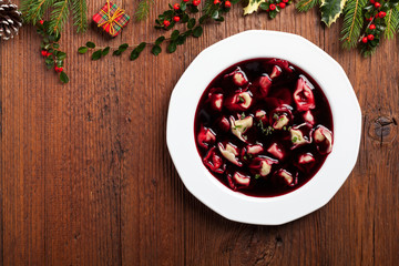 Traditional, Polish Christmas red borsch with dumplings.