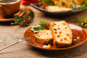 Christmas fruitcake. Natural wooden background.
