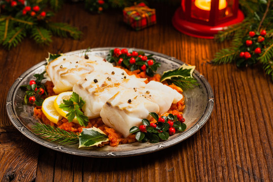 Christmas fish. Roasted cod pieces, served in vegetable sauce.