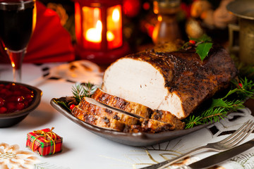 Roast pork loin with Christmas decoration.