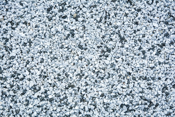 Small black and white pebble background. Top view texture