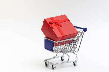 shopping cart present box with color ribbon on white background for christmas birthday special occasion