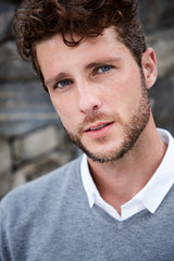 Fototapeta premium Handsome young guy in grey, portrait