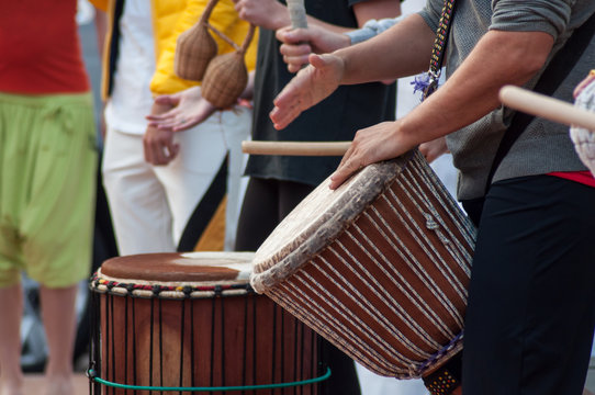 closeup of man hands on african drums in outdoor