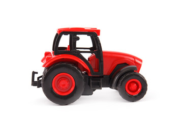 Fototapeta na wymiar Toy tractor isolated on white