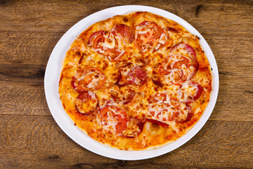 Pepperoni pizza with sausages