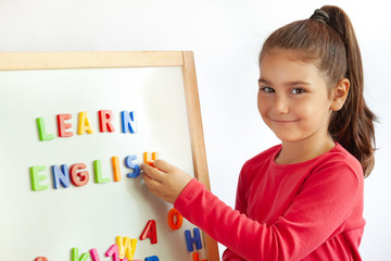 Language education concept. Learn English. Do you speak English. Cute little child girl with...