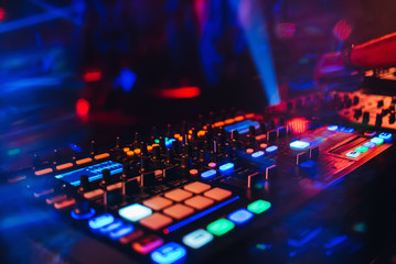 Fototapeta na wymiar DJ mixer controller panel for electronic music in night club