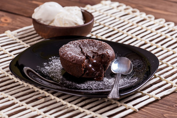 Mouth watering delicious chocolate fondant cake, restaurant serving.