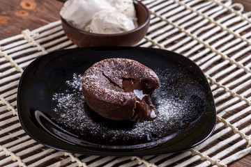 Mouth watering delicious chocolate fondant cake, restaurant serving.