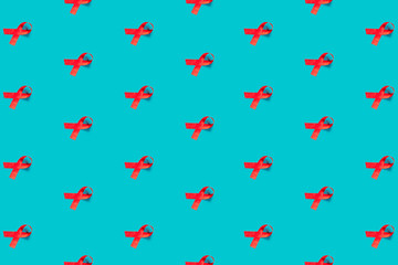 Red ribbon pattern on a blue background, flat lay. Top view.