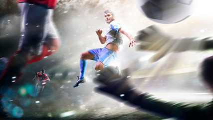 Soccer players in action on the grand stadium background panorama