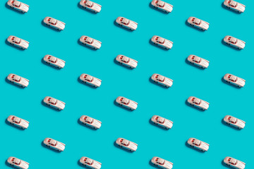 Silver car model on a blue background, flat lay. Pop view

