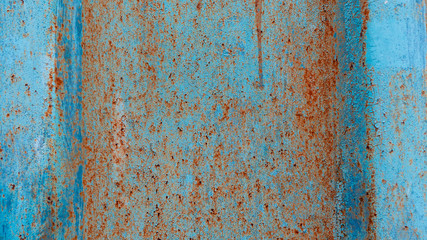 Rusty texture on a metal container that is on the street all year round.