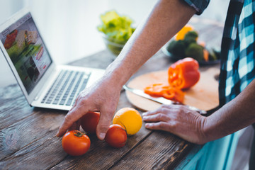 Ready for usage. Close up of tomatoes lying of the kitchen table while being ready for usage