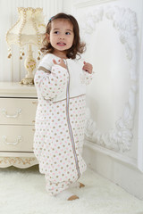 the beautife little girl in the pink bule pyjamas played in the room