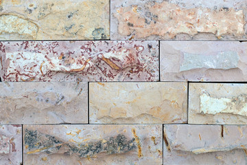 Light decorative wall tiles. Textured stone tiles. Different samples of facing tiles for finishing works