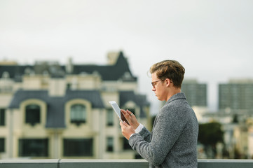 Man using a digital tablet at a rooftop in San Francisco