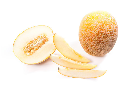 Whole, half and sliced honeydew melon tropical fruit isolated on a white background.