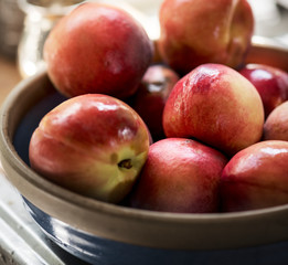 Fresh organic nectarines in a bowl