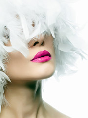 white feathers. young sexy woman with pink lips