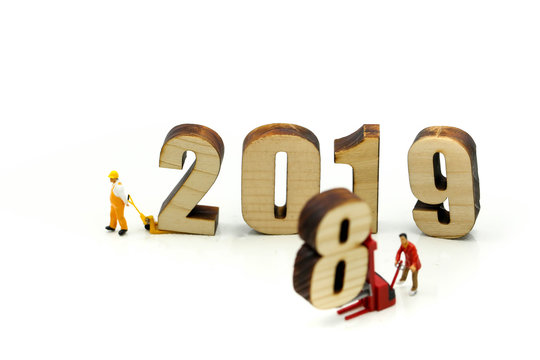 Miniature people : Worker with wooden of number 2019,Happy New Year 2019 concept.