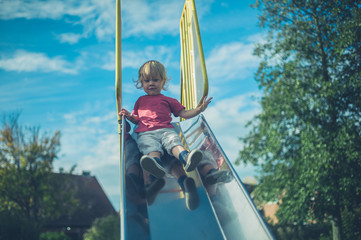 Toddler coming down the slide