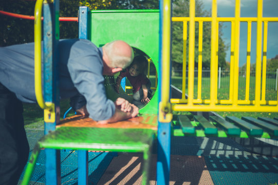 Toddler and grandfather at the playground