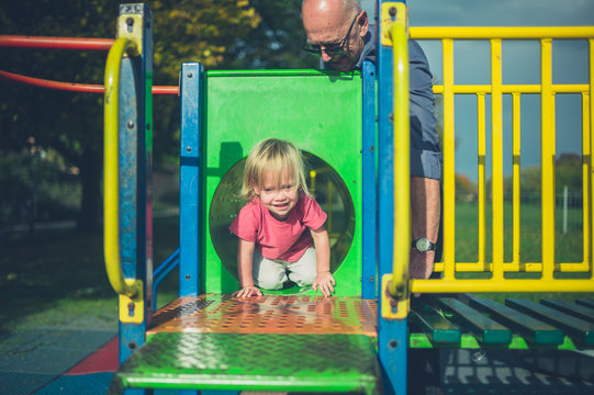 Toddler and grandfather at the playground