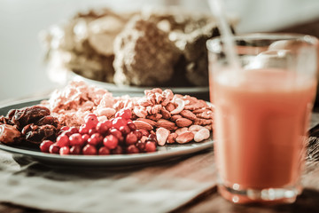Healthy breakfast. Plate with food standing near the glass with orange juice