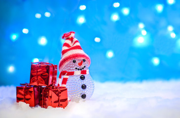 Christmas picture with a snowman and gifts