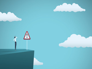 Obraz premium Business risk vector concept. Businessman standing on the edge of cliff with warning sign. Symbol of danger, failure, bankruptcy, recession and crisis.