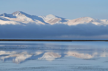 Fog over Son-Kul mountain lake early in the morning,central Tien Shan.Name translation is  &ldquo;the last lake&rdquo;, Kyrgyzstan,Central Asia,popular trekking and horse riding place