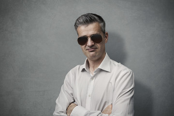 Cool man posing with sunglasses