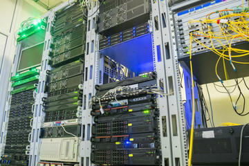 Naklejka premium Modern datacenter of cable Internet provider. Server room with a lot of computer equipment. Wired network operator's site