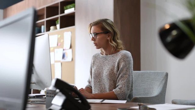 Business woman having headache at office