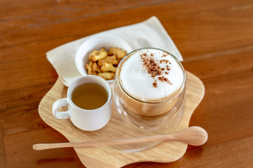 cup of coffee on wooden table