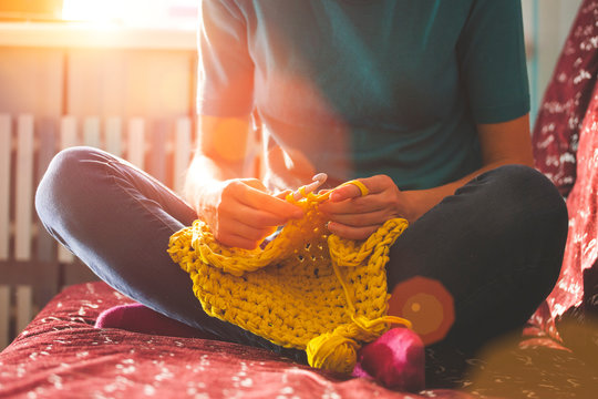 Woman knits crochet.