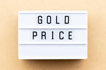 Light box with word gold price on wood background