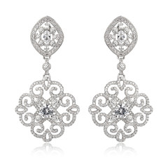 Pair of silver diamond earrings isolated on white